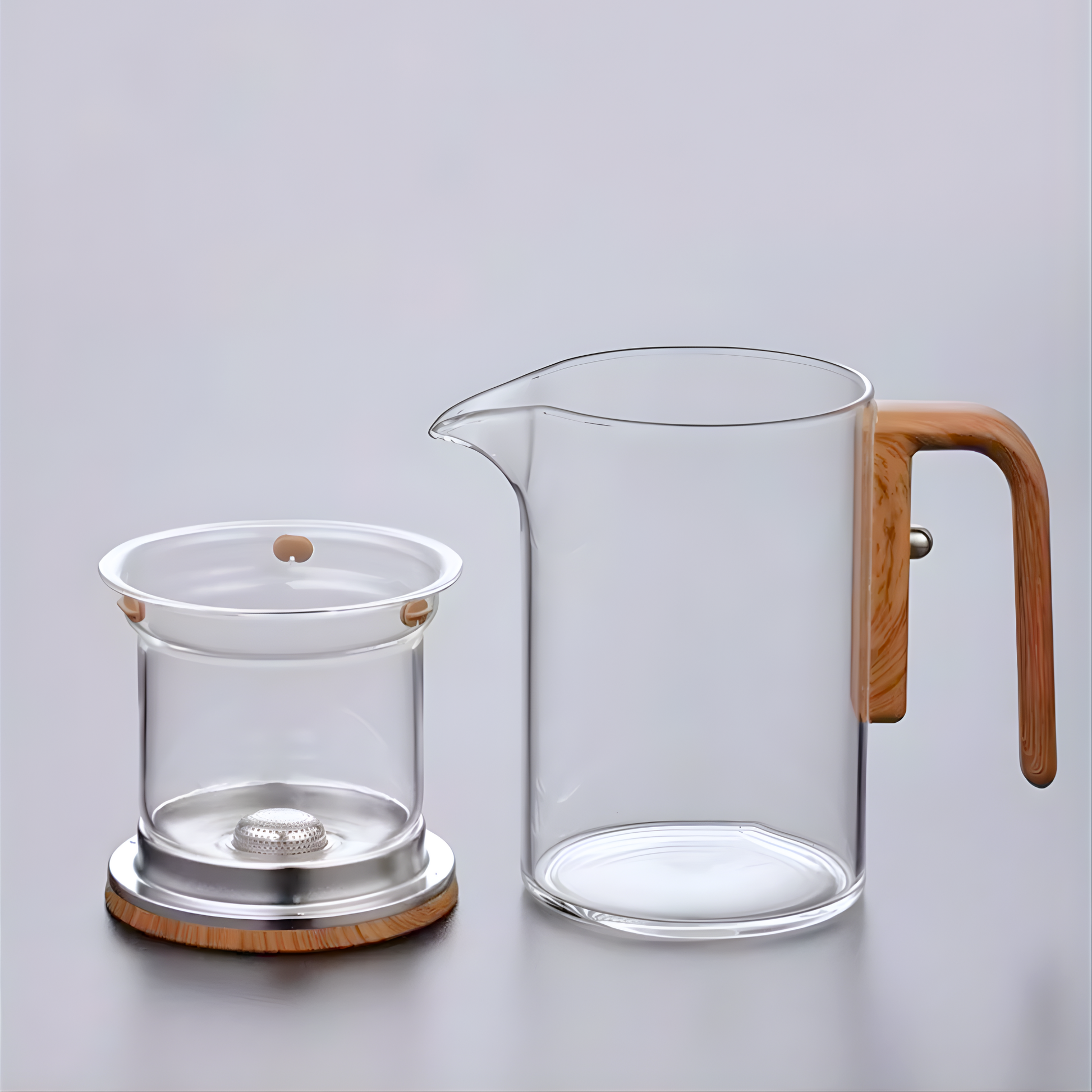 Disassembled clear borosilicate glass teapot with wooden handle