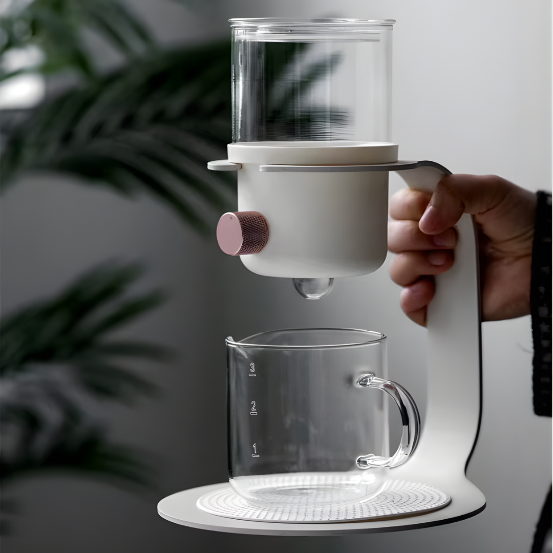 Modern white teapot held in a hand